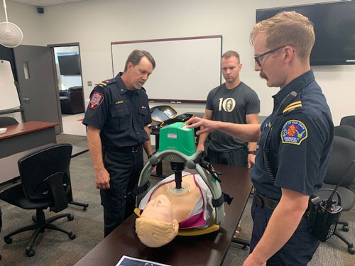 Cpt. Brad Brown and FF Hayden Crawford receive a tutorial of the device from RDES EMS Supervisor Donavon Brandon