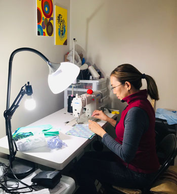 Woman sewing a face mask