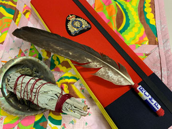 The red case symbolizes protection and healing and includes a beaded eagle feather, and a copy of the affirmation.