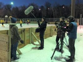 documentary crew working during blind hockey game