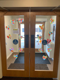 Entrance doors decorated with homemade hearts