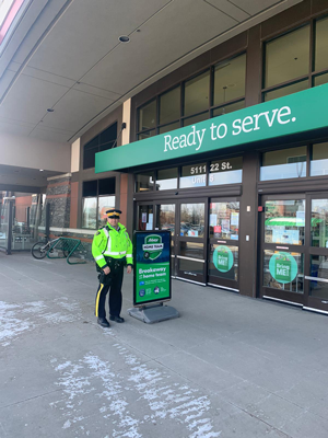 RCMP officer at front entrance of Sobey's